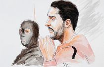 A court artist drawing shows Mehdi Nemmouche (right) during his trial.