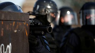 A French riot police officer holds a LDB-40 flashball in Paris in Feb 2019.