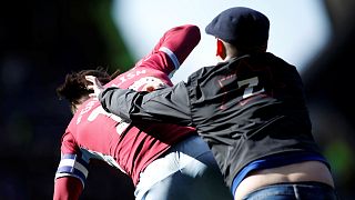 Fan attacks Aston Villa player Jack Grealish on pitch during Championship match
