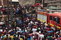 Rescue workers at the site of a collapsed building in Lagos, Nigeria