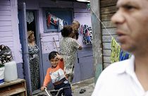 A Roma family is seen in the Cesmin Lug Camp outside Trepca mine, on the ou
