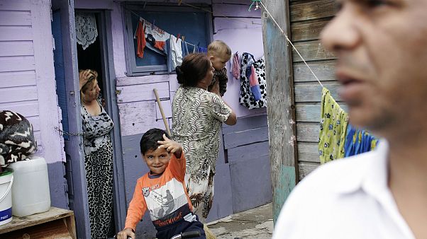 A Roma family is seen in the Cesmin Lug Camp outside Trepca mine, on the ou A Roma family is seen in the Cesmin Lug Camp outside Trepca mine, on the ou