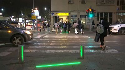 Tel Aviv installs 'zombie lights' for pedestrians addicted to mobile phones