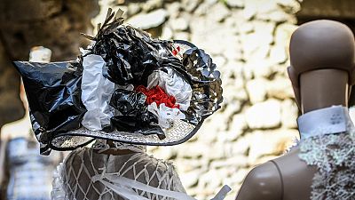 Eco-friendly designers create haute couture fashion out of trash