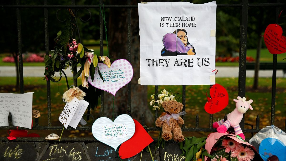 Signs at a memorial site for victims of the Christchurch mosque shootings
