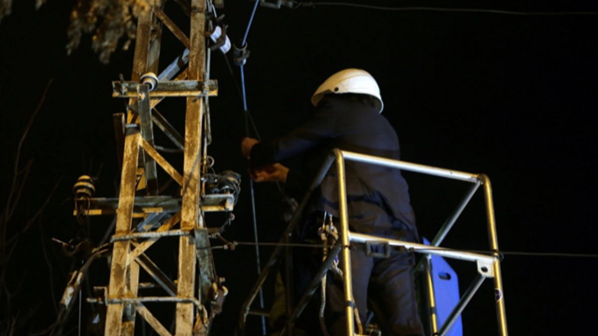 Nicolae Robu cutting telecommunications cables.