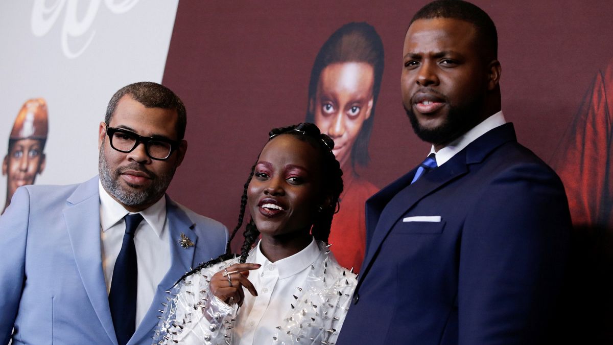 Director Peele, and actors Nyong'o and Duke attend the "Us" premiere