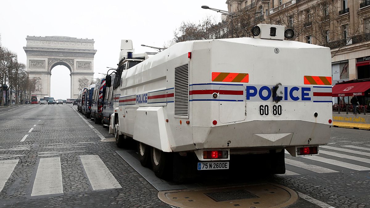 French police water canon vehicle is in place on the Champs-Elysees