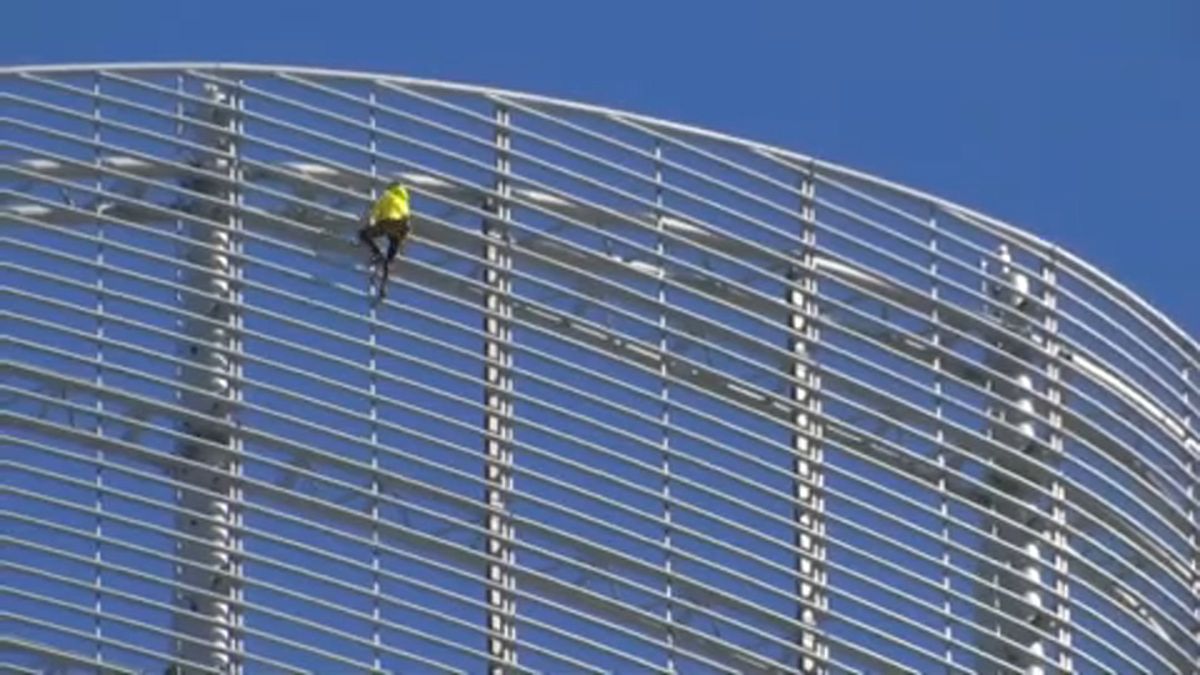 French "Spiderman" climbs skyscraper to save crumbling Notre-Dame cathedral