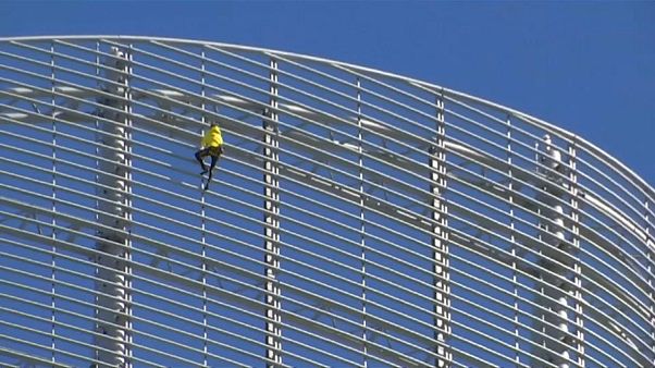Robert scaled the 185-metre glass-fronted building in La Défense Robert scaled the 185-metre glass-fronted building in La Défense