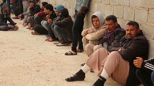 بعض المهاجرين الذين تمكنوا من الهرب في ليبيا بعض المهاجرين الذين تمكنوا من الهرب في ليبيا