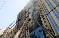 Firefighters battle deadly Dhaka building fire