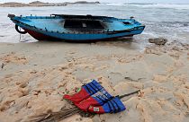 A boat used by migrants is seen near the western town of Sabratha