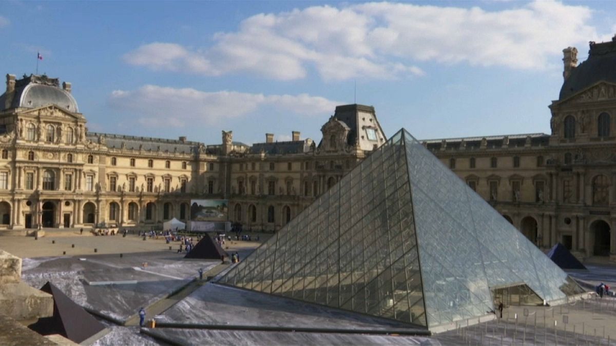 Louvre Pyramid with JR's artwork preparations 