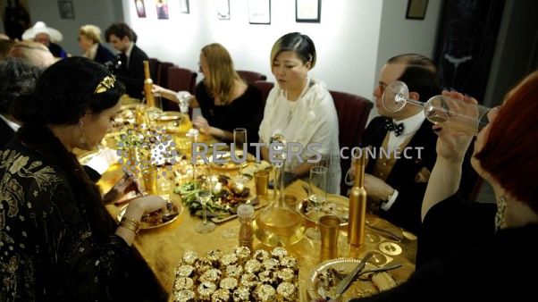 Guests attend a dinner with 24 carat gold-covered dishes, Guests attend a dinner with 24 carat gold-covered dishes,