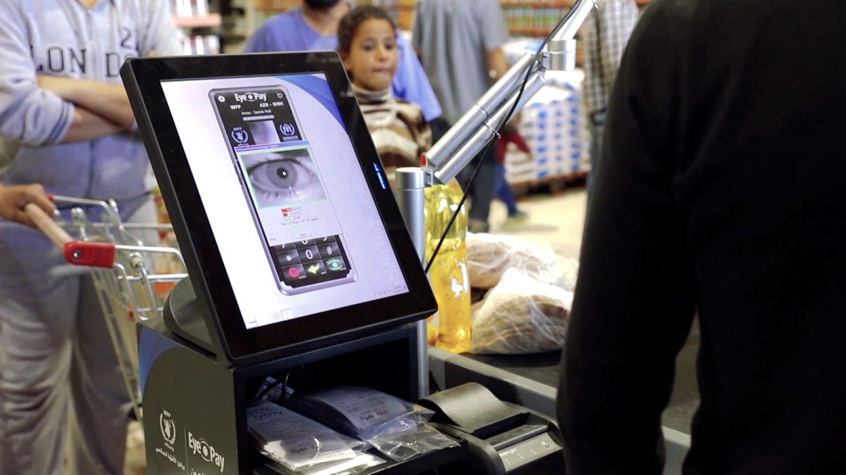 Refugees in Jordan are buying groceries with eye scans
