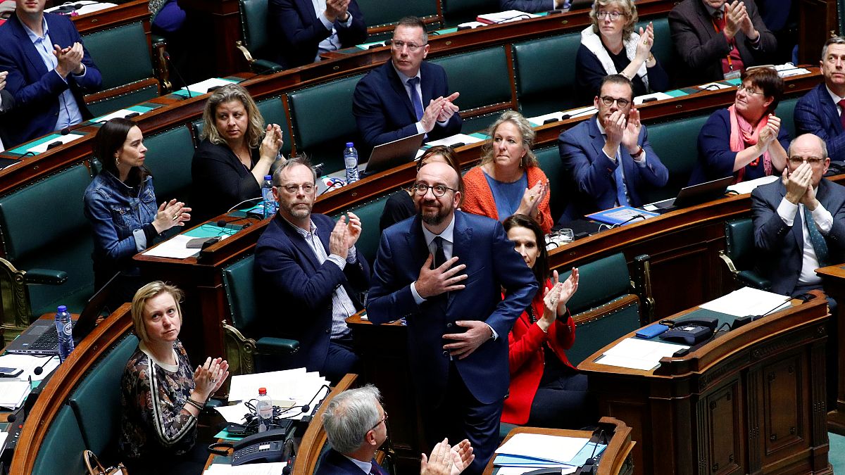 Belgium's Prime Minister Charles Michel reacts after delivering a speech 
