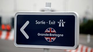 A road exit sign at the pit stop zone at Eurotunnel terminal in Coquelles.