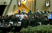 Iranian lawmakers wear Revolutionary Guards uniforms to parliament