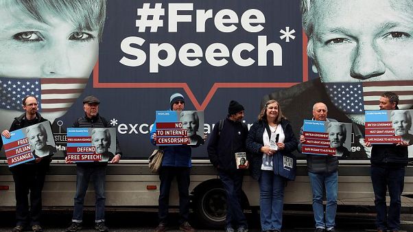 Assange 's supporters in front the Ecuador embassy of London. Assange 's supporters in front the Ecuador embassy of London.