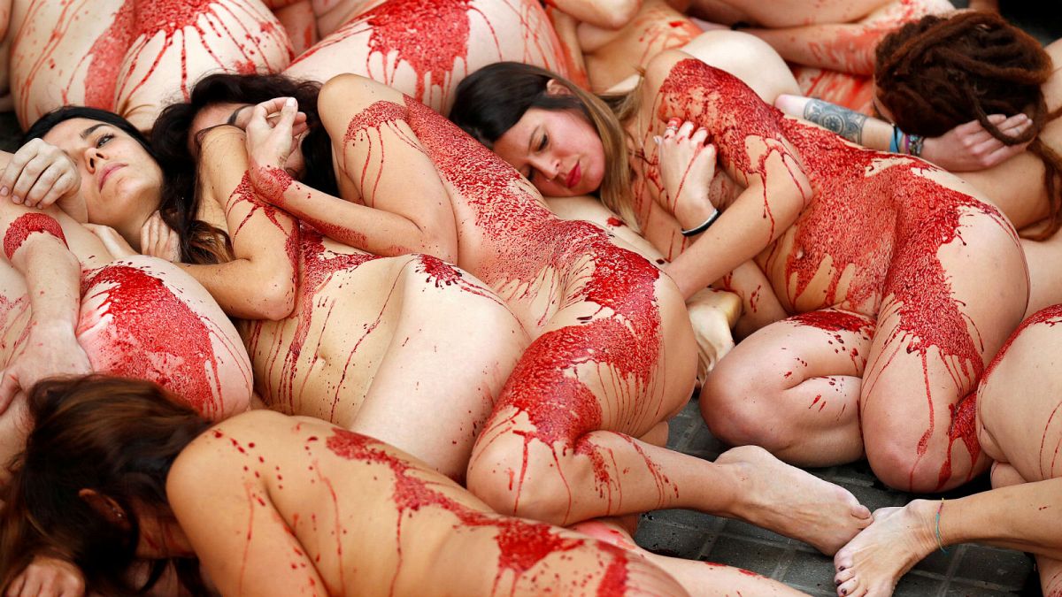 Animal rights activists, covered in fake blood, at a protest in Barcelona