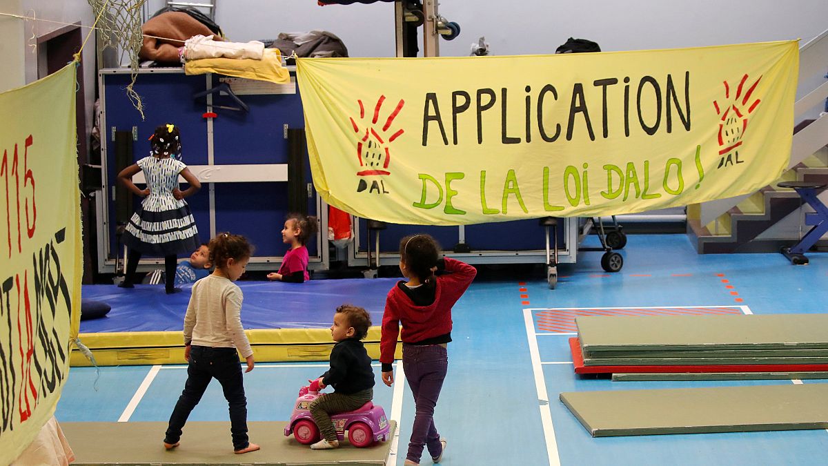 Dozens of homeless families live in the gymnasium Roquepine, Paris