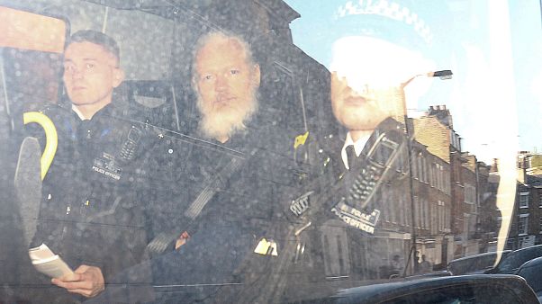 Julian Assange taken away to Belmarsh prison in London Julian Assange taken away to Belmarsh prison in London