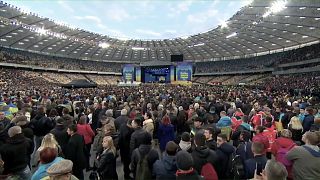 Ukraine election: presidential candidates trade barbs in stadium debate