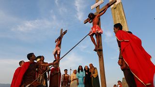 Actors are seen on the cross in a re-enactment of the crucifixion of Jesus