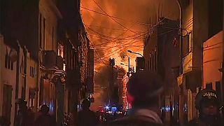 Flames tower over Lima's commercial zone