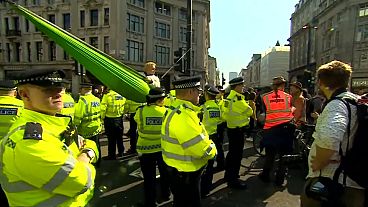 Activist blocking Oxford street with hammock