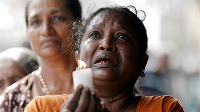 Colombo residents observe a moment of silence