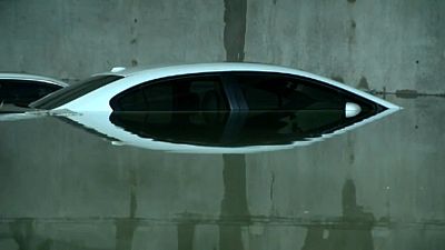 Cars submerged at airport car-park after storms in Dallas