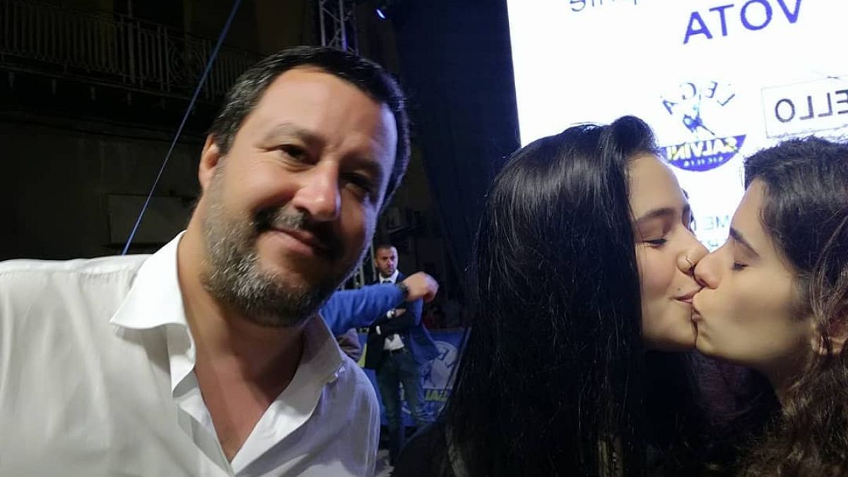 Kissing girls photobomb Salvini in protest over anti-LGBT conference