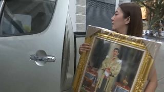 Shoppers are purchasing framed pictures of Thailand's new monarch