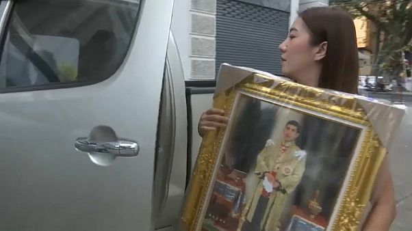 Shoppers are purchasing framed pictures of Thailand's new monarch Shoppers are purchasing framed pictures of Thailand's new monarch
