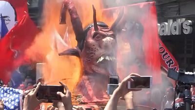 Filipino workers mark May Day by burning President Duterte's effigy