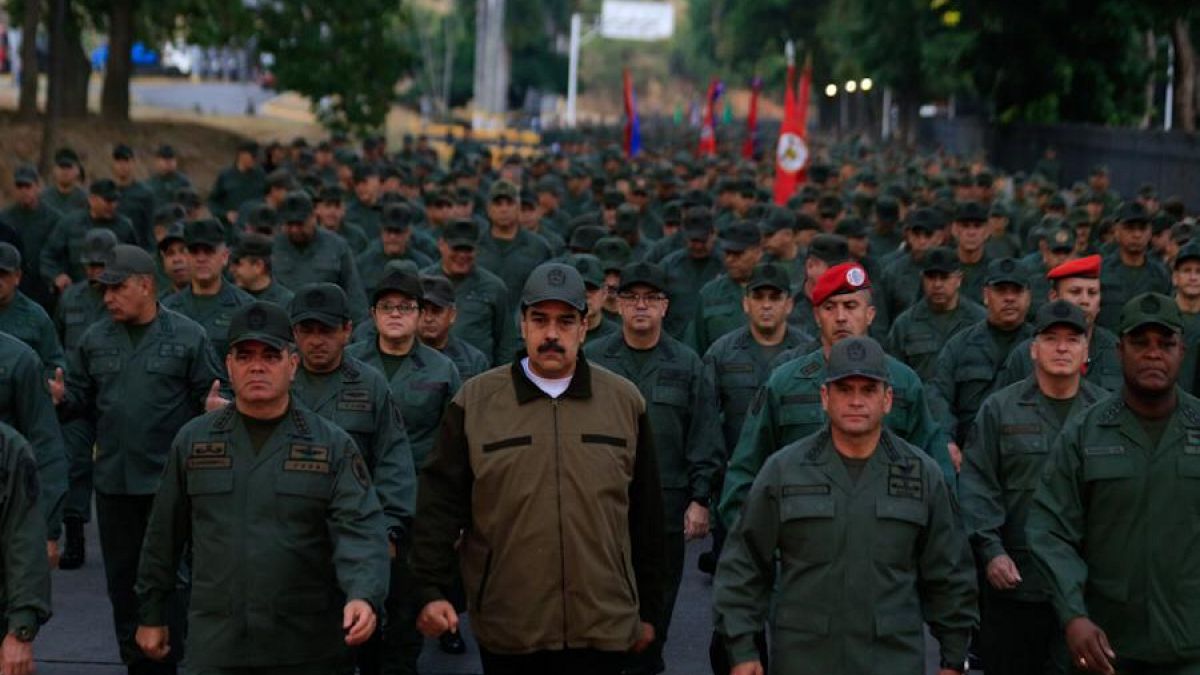 Defiant Maduro tweets pictures of himself with Venezuela's army