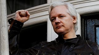 Julian Assange refuses to surrender to US extradition at court hearing in London