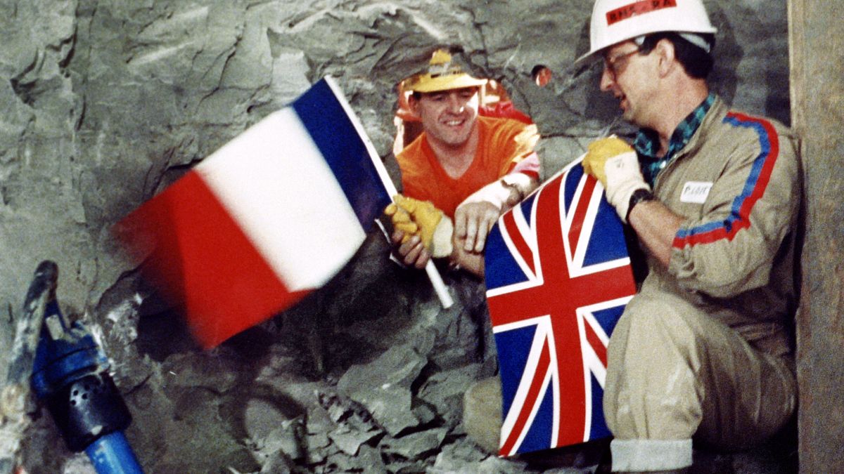 FILE PHOTO: Tunnel workers Philippe Cozette and Graham Fagg, 1990
