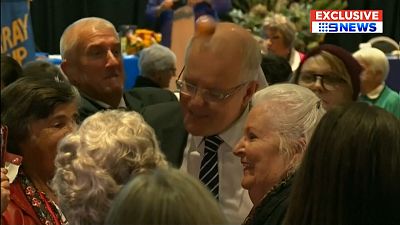 Woman hits Australia PM Scott Morrison with an egg during campaigning