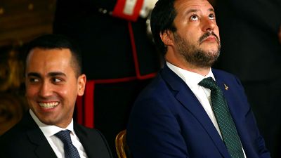 Interior Minister Matteo Salvini looks to the heavens next to Italy's Minister of Labour