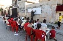 Irak'ın Kerkük kentinde emekli öğretmen Hamis Ali ve öğrencileri