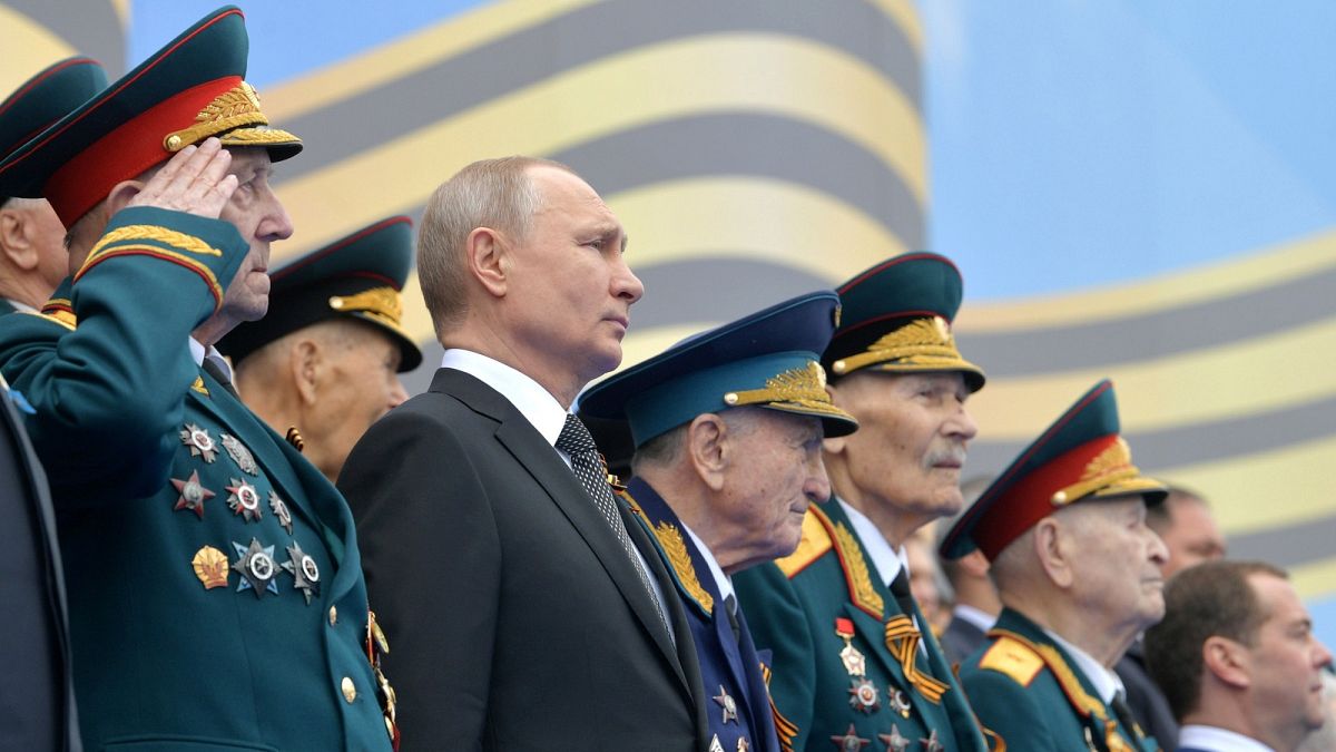 Vladimir Putin attends the Victory Day parade at the Kremlin.