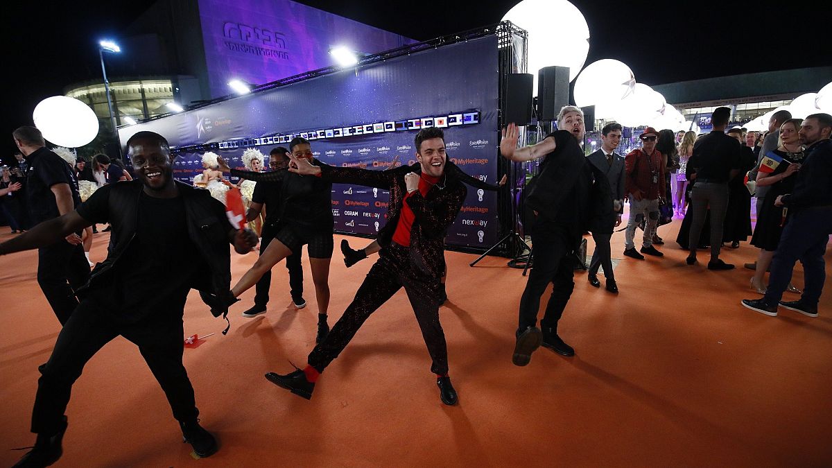 Luca Hänni of Switzerland shows off his dance moves on the Orange Carpet