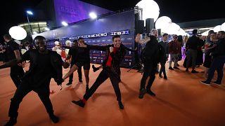 Luca Hänni of Switzerland shows off his dance moves on the Orange Carpet