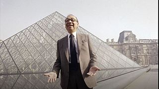 Architect I.M. Pei stands in front of the Louvre