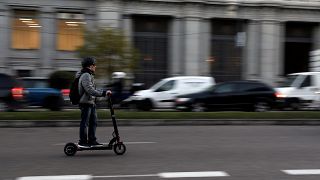 A man rides an electric scooter in Madrid, Spain, December 4, 2018.