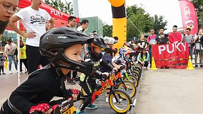 Young riders sprint on balance bike course in southwest China
