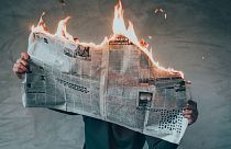 Newspaper on fire